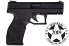 TAURS TX22 ANODIZED BLACK BLACK POLYMER FRAME RIGHT SIDE VIEW WITH GUNS AND AMMO HANDGUN OF THE YEAR 2019 STAMP