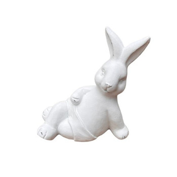 17602A584 White Bunny Lounging On Back