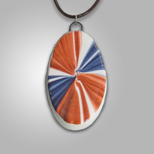 A patriotic oval ceramic Red white blue burst pendant necklace. On a black cord necklace. A patriotic oval ceramic Red white blue burst pendant necklace. On a black cord necklace.