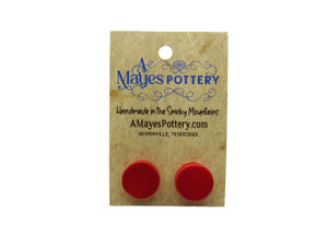 A set of handmade ceramic red medium circles post earrings. On an A Mayes Pottery card. A set of handmade ceramic red medium circles post earrings. On an A Mayes Pottery card.