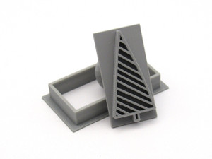 A Modern Striped Christmas Tree Rectangle Pendant Stamp with Cutter. Shown with stamp tilted up against cutter. A Modern Striped Christmas Tree Rectangle Pendant Stamp with Cutter. Shown with stamp tilted up against cutter.