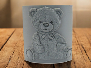 A Teddy bear Clay Pottery Texture Image Stamp. With a wood look background. A Teddy bear Clay Pottery Texture Image Stamp. With a wood look background.