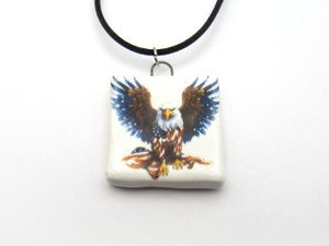 A Patriotic Eagle Holding Flag (V1) Infusion square ceramic pendant necklace. With a black cord. A Patriotic Eagle Holding Flag (V1) Infusion square ceramic pendant necklace. With a black cord.