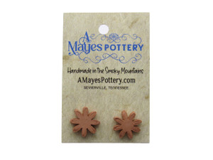 A set of small flower aromatherapy terracotta post earrings. On an A Mayes Pottery card. A set of small flower aromatherapy terracotta post earrings. On an A Mayes Pottery card.