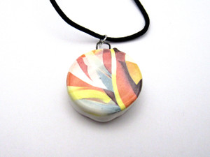 A handmade abstract (Design 5) colorful ceramic round pendant necklace. On a black cord necklace. A handmade abstract (Design 5) colorful ceramic round pendant necklace. On a black cord necklace.