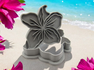 Hibiscus flower shaped clay pottery stamp with cutter. With a beach look background.
