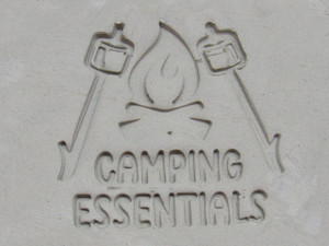 A Clay imprint of the Camping Essentials Mug clay Stamp. A clay imprint of the camping essentials mug clay stamp. A Clay imprint of the Camping Essentials Mug clay Stamp. A clay imprint of the camping essentials mug clay stamp.