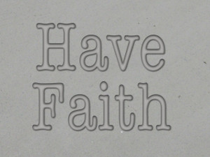 A clay imprint of the words "Have Faith". A clay imprint of the words "Have Faith".