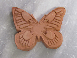 A Brown Sugar Saver Butterfly Terracotta Clay Handcrafted in USA. On gray marble look background. A brown sugar butterfly terracotta clay handcrafted in USA. On gray marble look background. A Brown Sugar Saver Butterfly Terracotta Clay Handcrafted in USA. On gray marble look background. A brown sugar butterfly terracotta clay handcrafted in USA. On gray marble look background.