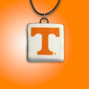 A TN Vols Power T on square Handcrafted Ceramic Necklace. On an orange background. A TN Vols Power T on square handcrafted Ceramic Necklace. On an orange background. A TN Vols Power T on square Handcrafted Ceramic Necklace. On an orange background. A TN Vols Power T on square handcrafted Ceramic Necklace. On an orange background.