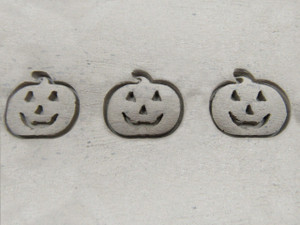 A clay imprint of a Smiling Pumpkin Halloween Border Clay slab pottery stamp. A clay imprint of a smiling pumpkin Halloween border clay stamp. A clay imprint of a Smiling Pumpkin Halloween Border Clay slab pottery stamp. A clay imprint of a smiling pumpkin Halloween border clay stamp.