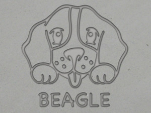 A clay imprint of a Beagle mug clay pottery stamp. With a Beagle head with paws on top of the word Beagle. A clay imprint of a beagle mug clay pottery stamp. With a beagle head with paws on top of the word beagle. A clay imprint of a Beagle mug clay pottery stamp. With a Beagle head with paws on top of the word Beagle. A clay imprint of a beagle mug clay pottery stamp. With a beagle head with paws on top of the word beagle.