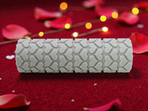 Valentines Organized Heart Texture Roller on table with rose petals