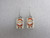 A set of handmade ceramic Christmas Santa on white rectangles clay dangle Earrings. A set of handmade ceramic Christmas Santa on white rectangles clay dangle Earrings.