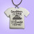 A handmade ceramic Tshirt pendant with the words "Countdown is Over Its Cruise Time". With a purple background.