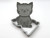 A cute cat shaped pottery stamp with cutter. Shown with stamp tilted against cutter.