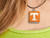 A TN Vols Orange with White Power T square ceramic necklace. On a black cord necklace.
