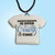 A handmade ceramic Tshirt pendant with the words "Countdown is Over It's Cruise Time" necklace. On a black cord necklace. With a bright blue background.