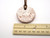 A handmade round terracotta white lace aromatherapy ceramic pendant necklace. With ruler. A handmade round terracotta white lace aromatherapy ceramic pendant necklace. With ruler.