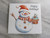 A handcrafted Snowman holding cupcake with the words "Happy Holidays" ceramic Holiday trivet hot pad. With a gray marble look background. A handcrafted Snowman holding cupcake with the words "Happy Holidays" ceramic Holiday trivet hot pad. With a gray marble look background.