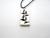 A white with black rectangle leaves with stems (Design 2) pendant necklace.