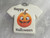 Handmade Ceramic Halloween Tshirt Silly Pumpkin (Design 1) With the words Happy Halloween pendant necklace. On a gray marble look background. Handmade Ceramic Halloween Tshirt Silly Pumpkin (Design 1) With the words Happy Halloween pendant necklace. On a gray marble look background.