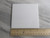 A plain white Ceramic Coaster Hot Pad Trivet. With a ruler. Measuring approximately 4 inches wide. A plain white Ceramic Coaster Hot Pad Trivet. With a ruler. Measuring approximately 4 inches wide.