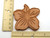 A finished Tropical Hibiscus terracotta brown clay sugar saver. Measuring approximately 2.5 inches by 2.5 inches.