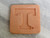 A finished brown sugar saver with the University of Tennessee Power T.  On a gray marble look background. A finished brown sugar saver with the University of Tennessee Power T.  On a gray marble look background.
