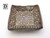 A handcrafted square shaped trinket bowl. The main color is bright green with a cross like pattern in brown raised imprints on the dish. A handcrafted square shaped trinket bowl. The main color is bright green with a cross like pattern in brown raised imprints on the dish.