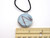 A round Blue & Black Abstract Design Ceramic Pendant Necklace. On a black corded necklace.  With ruler. A round blue & black abstract design ceramic pendant necklace. On a black cord necklace. With ruler. A round Blue & Black Abstract Design Ceramic Pendant Necklace. On a black corded necklace.  With ruler. A round blue & black abstract design ceramic pendant necklace. On a black cord necklace. With ruler.