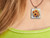A bundle of Colorful Sunflowers with leaves Handmade Ceramic Necklace. Shown on woman's neck. A bundle of Colorful Sunflowers with leaves Handmade Ceramic necklace. Shown on a woman's neck. A bundle of Colorful Sunflowers with leaves Handmade Ceramic Necklace. Shown on woman's neck. A bundle of Colorful Sunflowers with leaves Handmade Ceramic necklace. Shown on a woman's neck.