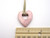 A Ceramic Open Heart Pendant Necklace Handmade from fired clay. With a beige corded necklace. With ruler. Measuring approximately 1 inch at the heart's widest points. A Ceramic Open Heart Pendant Necklace Handmade from fired clay. With a beige corded necklace. With ruler. Measuring approximately 1 inch at the heart's widest points.