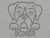A clay imprint of a Boxer mug clay pottery stamp. With a Boxer head with paws on top of the word Boxer.