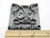A chihuahua head closeup with paws over the word chihuahua clay pottery mug stamp with ruler. Showing approximately 2.5 inches wide. A chihuahua head closeup with paws over the word chihuahua clay pottery mug stamp with ruler. Showing approximately 2.5 inches wide.