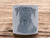 Airedale dog head close up, clay pottery stamp for potters to add texture image to ceramics, On a wood look background. Airedale dog head close up, clay pottery stamp for potters to add texture image to ceramics, On a wood look background.