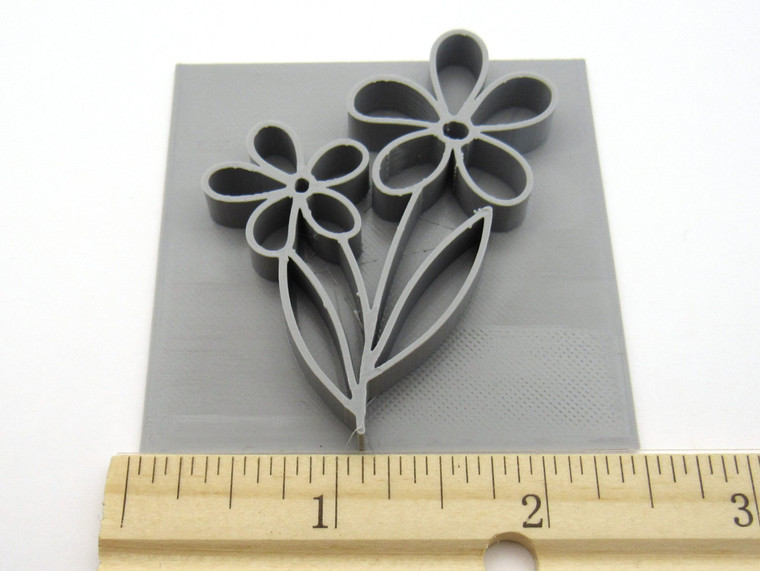 A 2 Spring Flowers Mug clay stamp for handbuild pottery. With ruler. Measuring approximately 2.5 inches wide.
