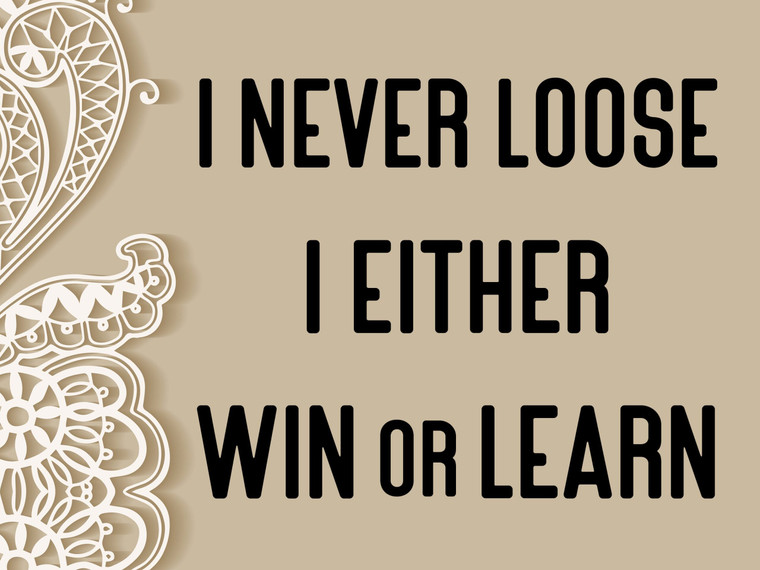 The words "I never lose I either win or learn" mug clay stamp for handbuild pottery. Written in black with a beige background.