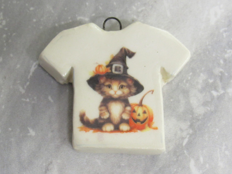 A handmade ceramic Halloween Tshirt Black cat with witches hat pendant.