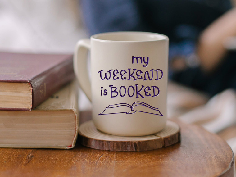 A mug with the words "my weekend is booked" on it.