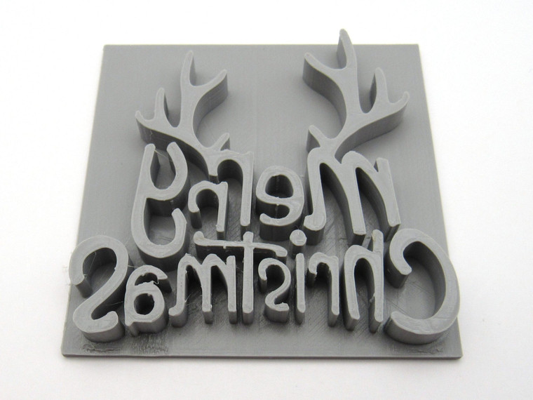 A Merry Christmas and Antlers mug clay stamp for slab pottery.