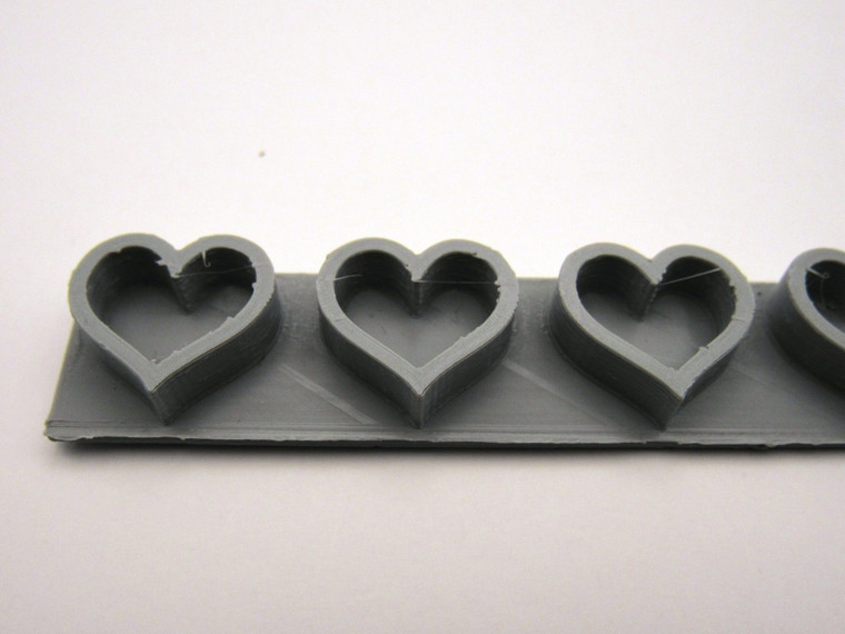 An outlined heart border stamp for handbuild pottery.