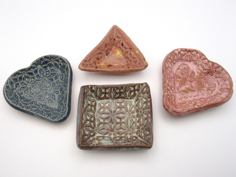 Handcrafted Ceramic Trinket Bowls & Jewelry Dishes – Made in the United States. Showing all four trinket bowls & Jewelry dishes: Two hearts, a triangle & square shape.