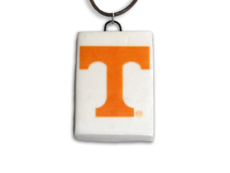 A TN Vols Power T rectangle handcrafted ceramic pendant. Pendant has a white background with the Orange Power T in the middle. With a black cord necklace.