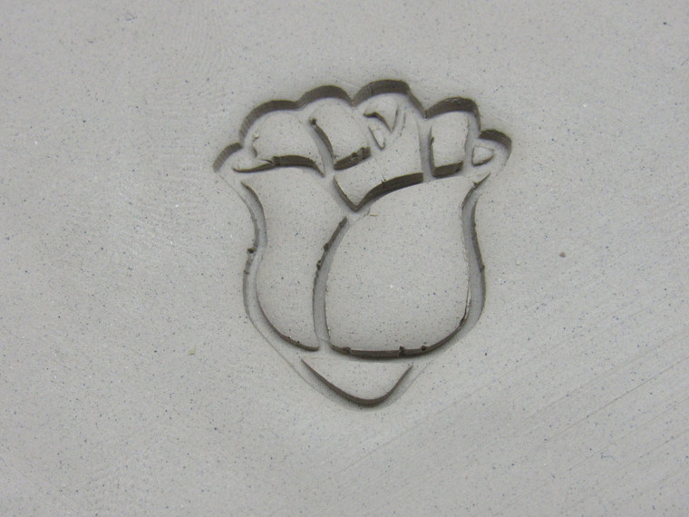 A clay imprint of the Rosebud Flower Pendant Clay Stamp with Round Cutter.