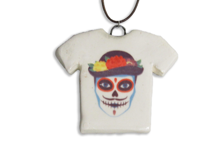 A Handmade Ceramic Tshirt Sugar Skull Halloween Necklace. A handmade ceramic Tshirt sugar skull Halloween Necklace.