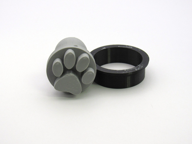 A Round Paw Print Clay Stamp with cutter. A round paw print clay stamp with cutter.