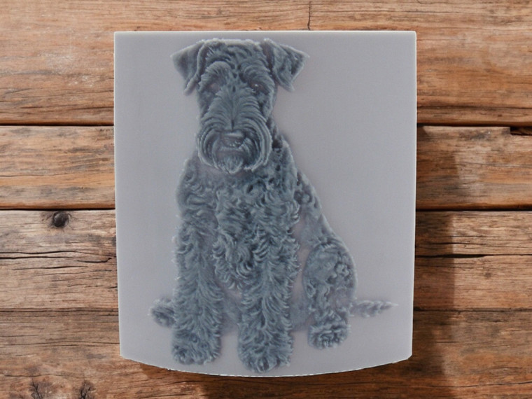 Airedale dog sitting, clay pottery stamp for potters to add texture image to ceramics.