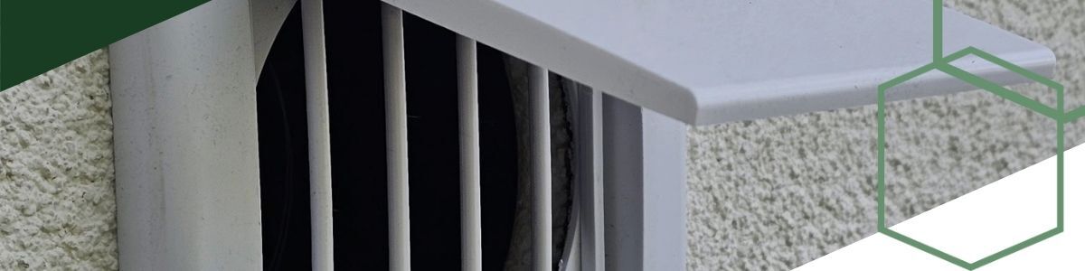 close-up of dryer vent on exterior of building