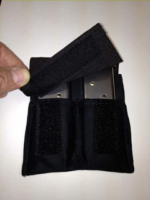 This "Medium" magazine pocket has a retention strap and is designed for extreme use (Law Enforcement).